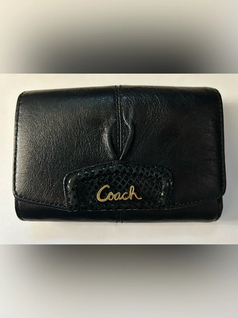 Coach Women’s Black Tri-Fold Wallet with Gold Script Logo